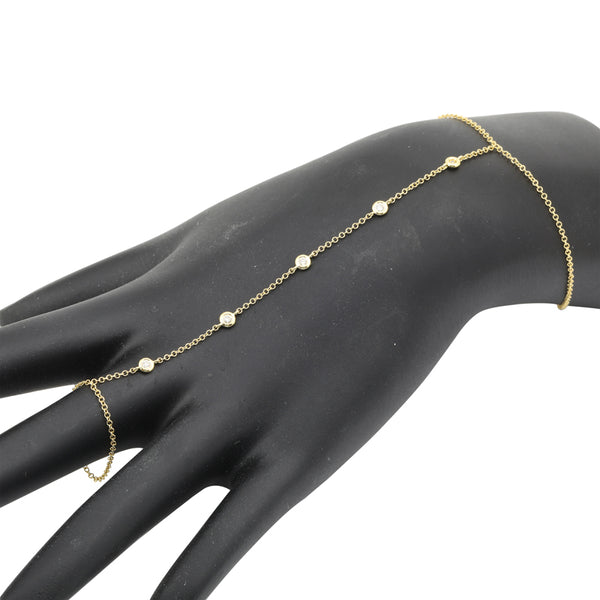 14k yellow gold bezel set diamond hand bracelet.  Five bezel...